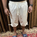 cream shorts with pockets on the side